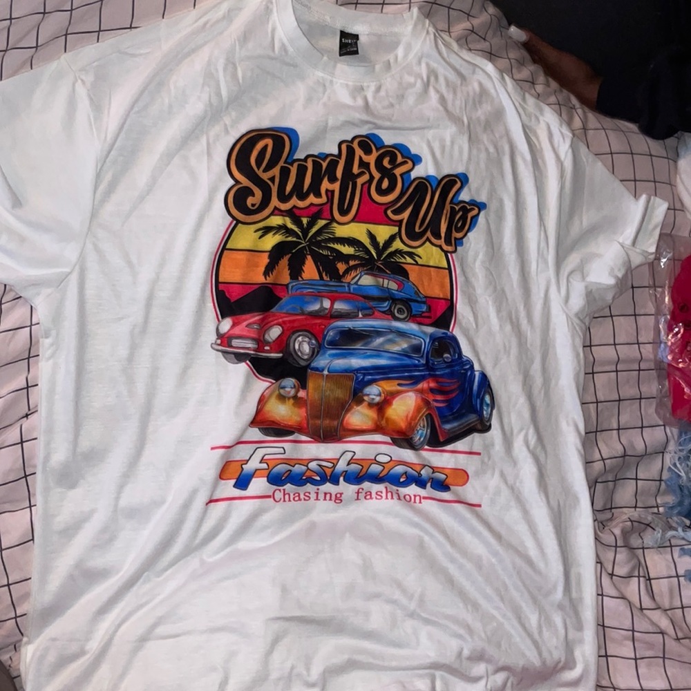 Size small never worn White shirt with logo in middle. Shirt is an oversized fit